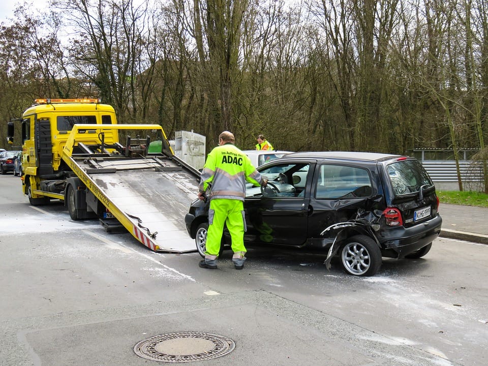 car going on towing truck